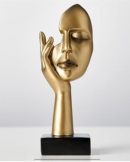 Figurka dekoracyjna twarz w złotych kolorach