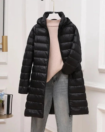 Długa damska pikowana kurtka zimowa z kapturem
