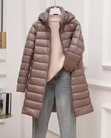 Długa damska pikowana kurtka zimowa z kapturem