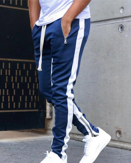 Sportowe dresy męskie z ozdobnym lampasem i suwakiem na nogawce