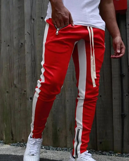 Sportowe dresy męskie z ozdobnym lampasem i suwakiem na nogawce