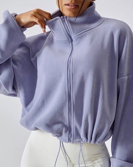 Sportowa bluza damska polarowa ze stójką i ściągaczem w pasie