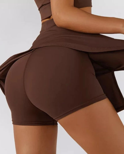 Sportowe legginsy damskie krótkie ze spódniczką