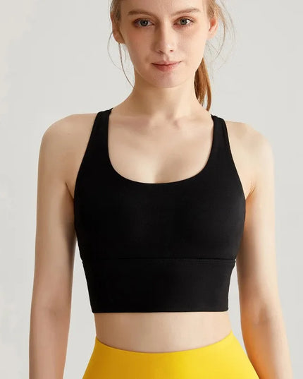 Sportowy top damski ze skrzyżowanymi ramiączkami i wszytymi miseczkami