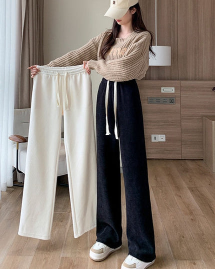 Damskie spodnie zimowe z szeroką nogawką ocieplane