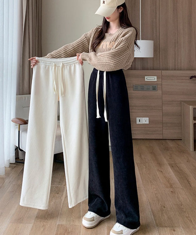 Damskie spodnie zimowe z szeroką nogawką ocieplane