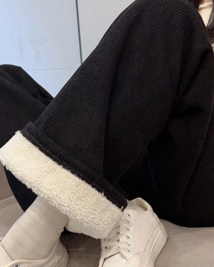 Damskie spodnie zimowe z szeroką nogawką ocieplane