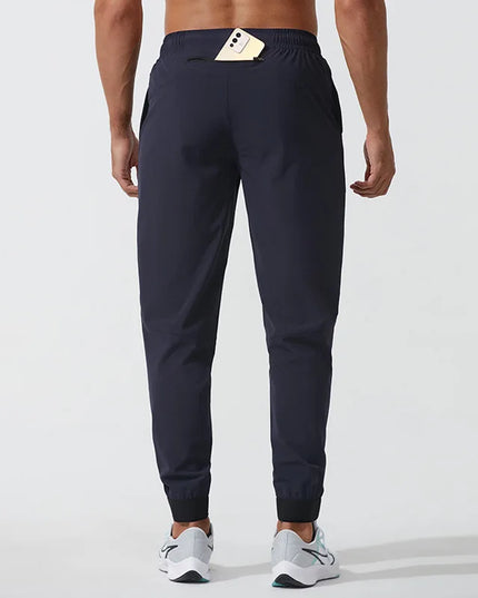 Sportowe dresy męskie elastyczne z dodatkową kieszonką