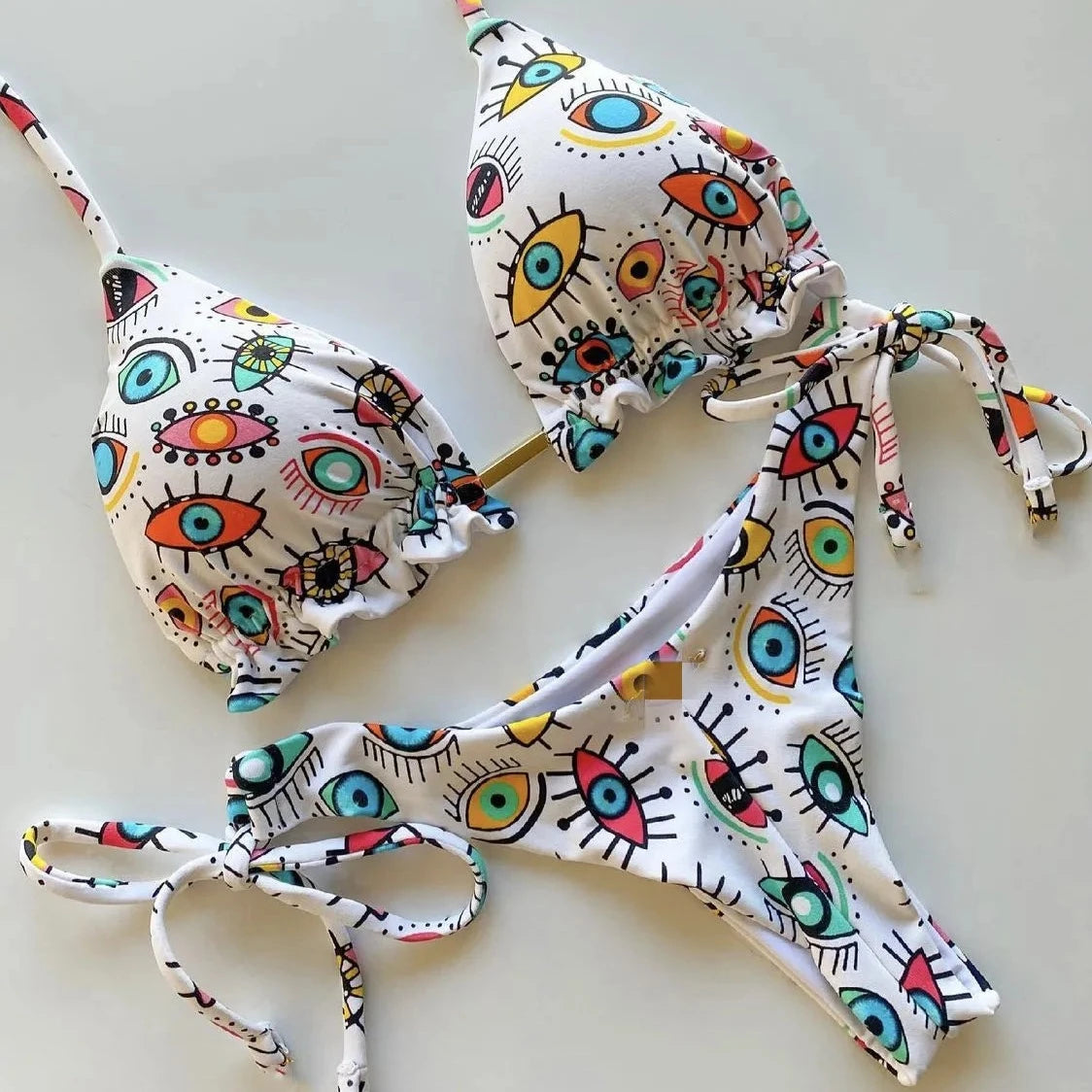 Dwuczęściowy strój kąpielowy mikrobikini wiązany ze wzorem w oczy