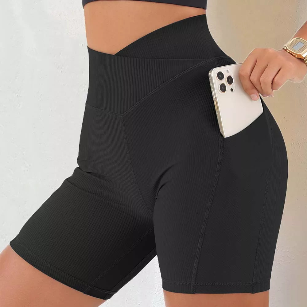 Sportowe legginsy damskie z wysokim stanem i kieszonką - krótki fason