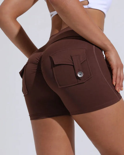 Sportowe legginsy damskie z kieszeniami - krótki krój