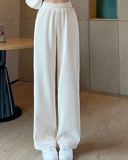 Damskie spodnie zimowe z szeroką nogawką ocieplane