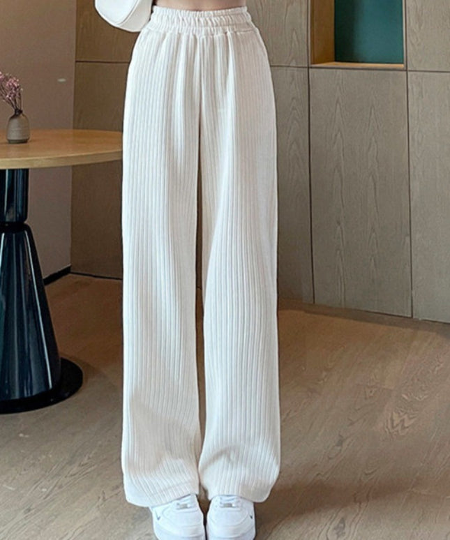 Damskie spodnie zimowe z szeroką nogawką ocieplane