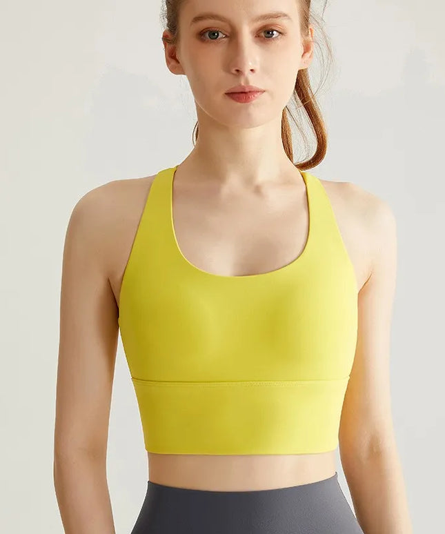 Sportowy top damski ze skrzyżowanymi ramiączkami i wszytymi miseczkami