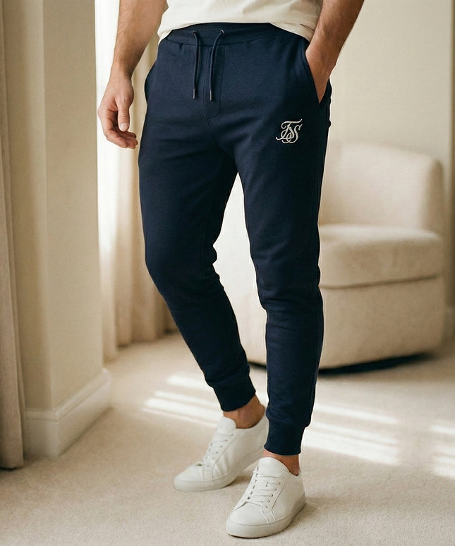 Sportowe dresy męskie ze zwężaną nogawką i kieszeniami