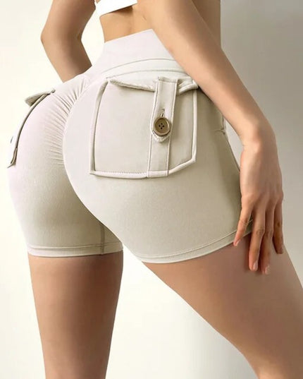 Sportowe legginsy damskie z kieszeniami - krótki krój