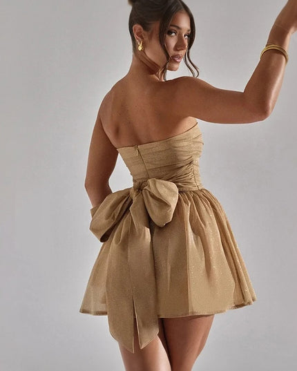 Sukienka mini błyszcząca z kokardą na plecach