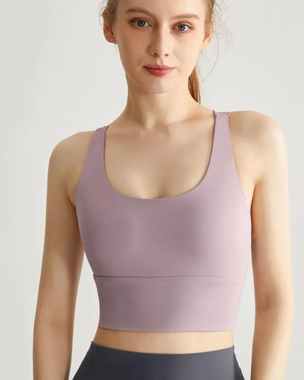 Sportowy top damski ze skrzyżowanymi ramiączkami i wszytymi miseczkami