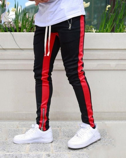 Sportowe dresy męskie z ozdobnym lampasem i suwakiem na nogawce