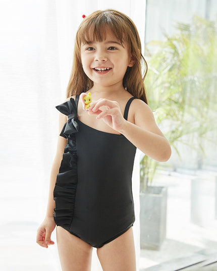 Jednoczęściowy strój kąpielowy dla dziewczynki na ramiączkach z falbankami i kokardą