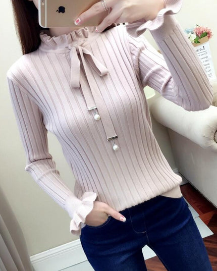 Damski sweter dziergany wykończony falbanką