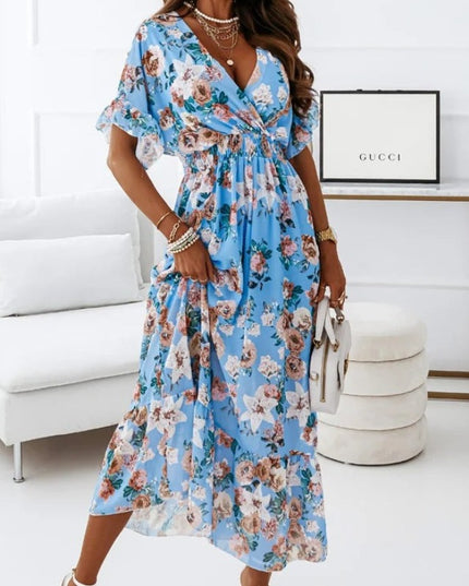 Sukienka midi w kwiatki z podkreśloną talią