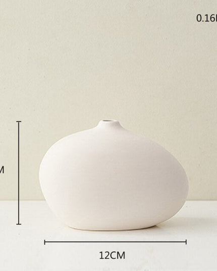 Wazon ceramiczny w jasnych kolorach reguralne kształty