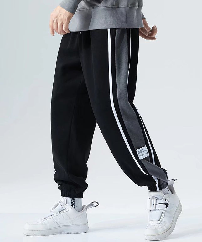 Męskie spodnie treningowe z ozdobnym pasem na nogawce