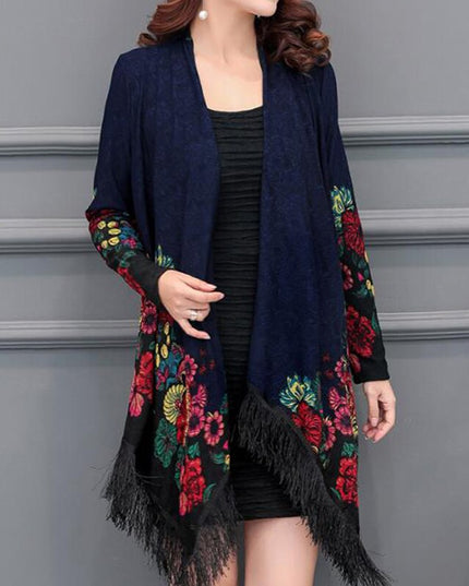 Damski sweter typu ponczo z frędzlami i haftem