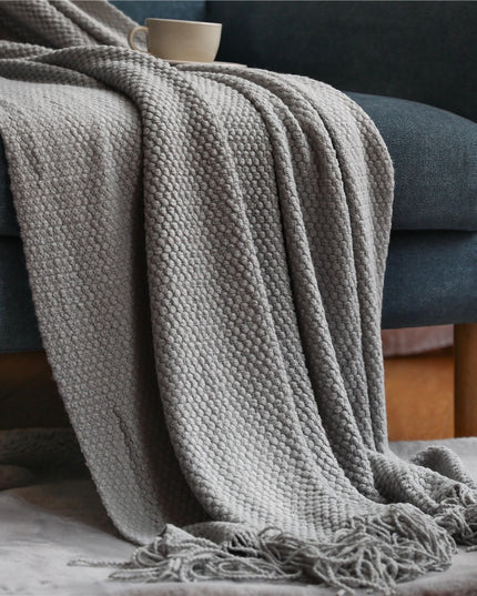 Dzianinowy koc z plecioną fakturą