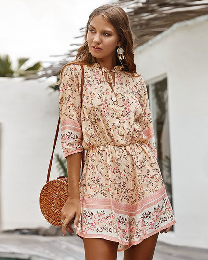 Damski kombinezon w kwiaty z rękawem 3/4