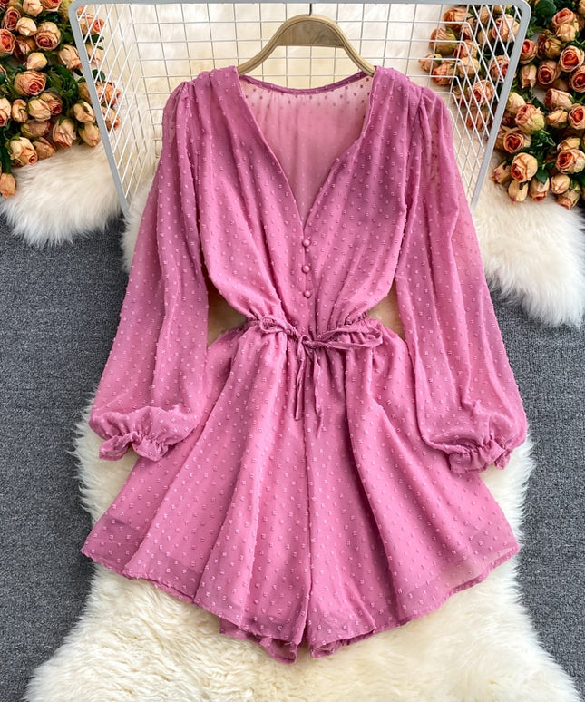 Damski kombinezon z długim rękawem i wiązaniem w talii