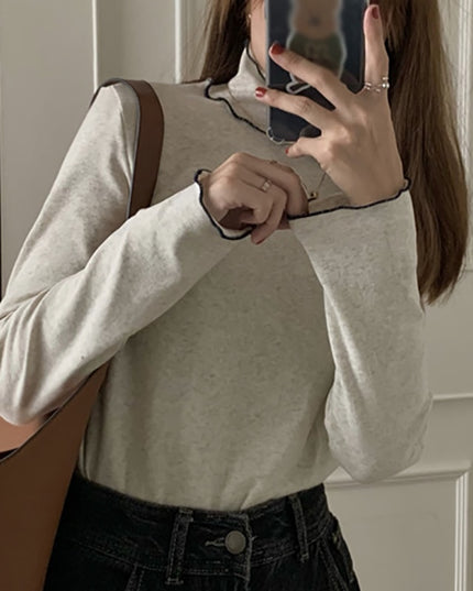 Damska koszulka z długim rękawem z golfem i falbanką