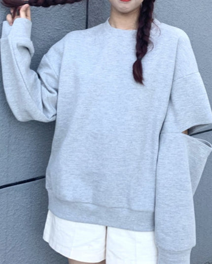 Damska bluza z rozcięciami na rękawach