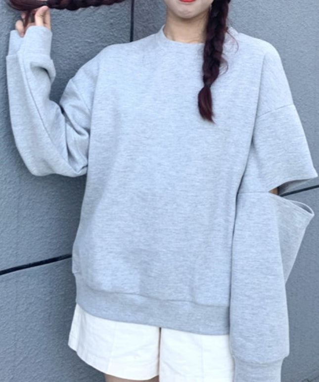 Damska bluza z rozcięciami na rękawach