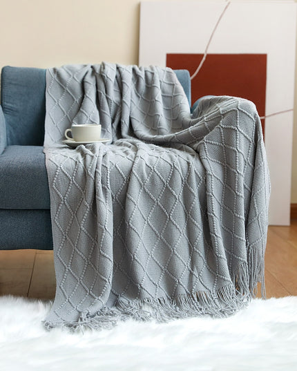 Koc z frędzlami i fakturą w romby