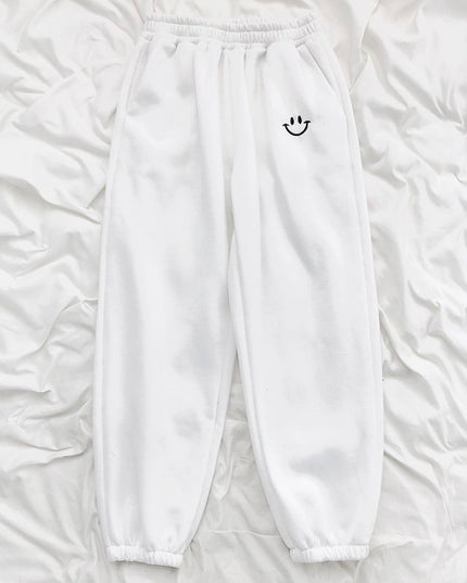 Damskie spodnie dresowe z naszywką