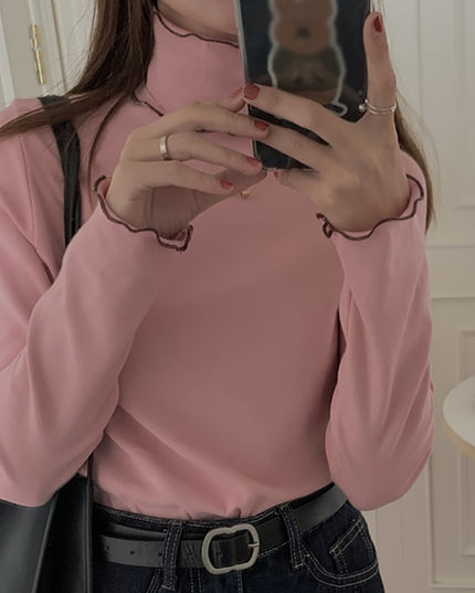 Damska koszulka z długim rękawem z golfem i falbanką