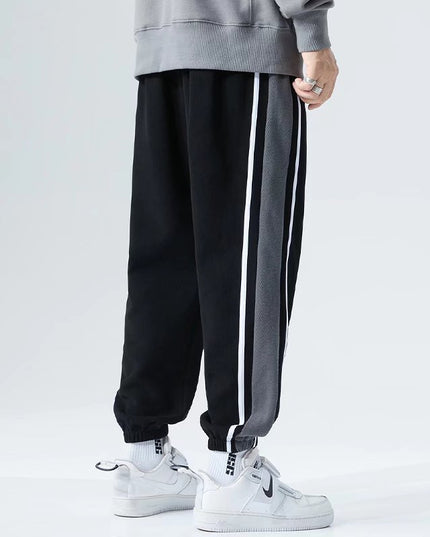 Męskie spodnie treningowe z ozdobnym pasem na nogawce