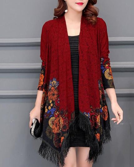 Damski sweter typu ponczo z frędzlami i haftem