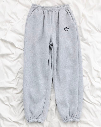 Damskie spodnie dresowe z naszywką