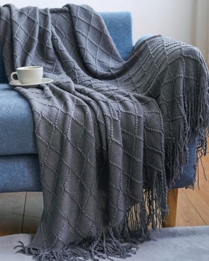 Koc z frędzlami i fakturą w romby