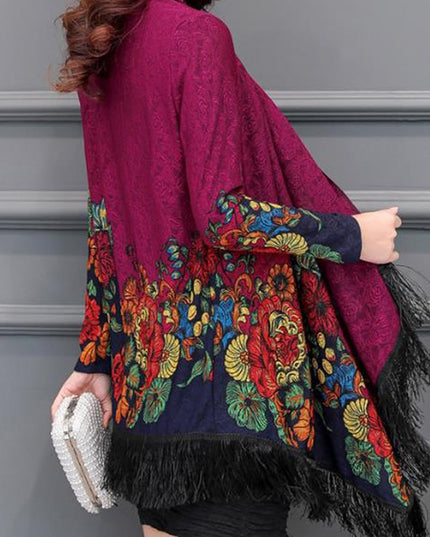 Damski sweter typu ponczo z frędzlami i haftem