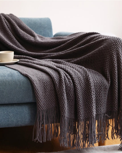 Dzianinowy koc z plecioną fakturą