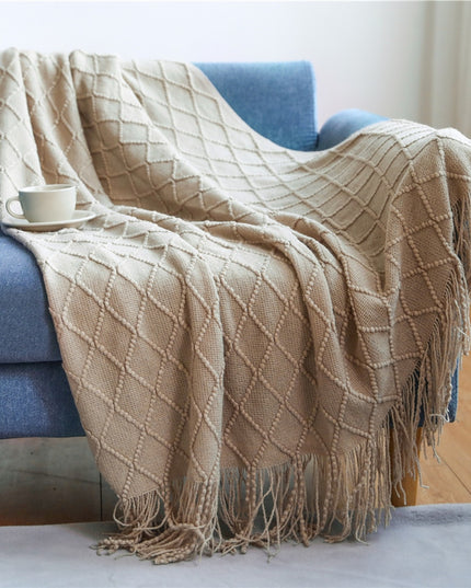 Koc z frędzlami i fakturą w romby