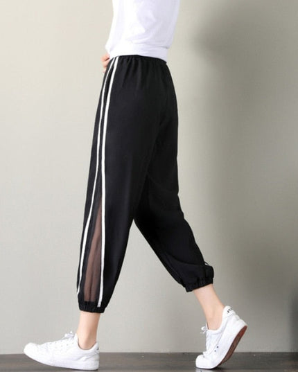 Damskie spodnie dresowe z ozdobną siateczką