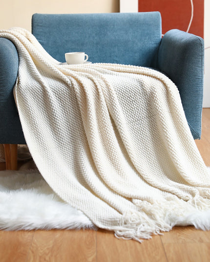 Dzianinowy koc z plecioną fakturą