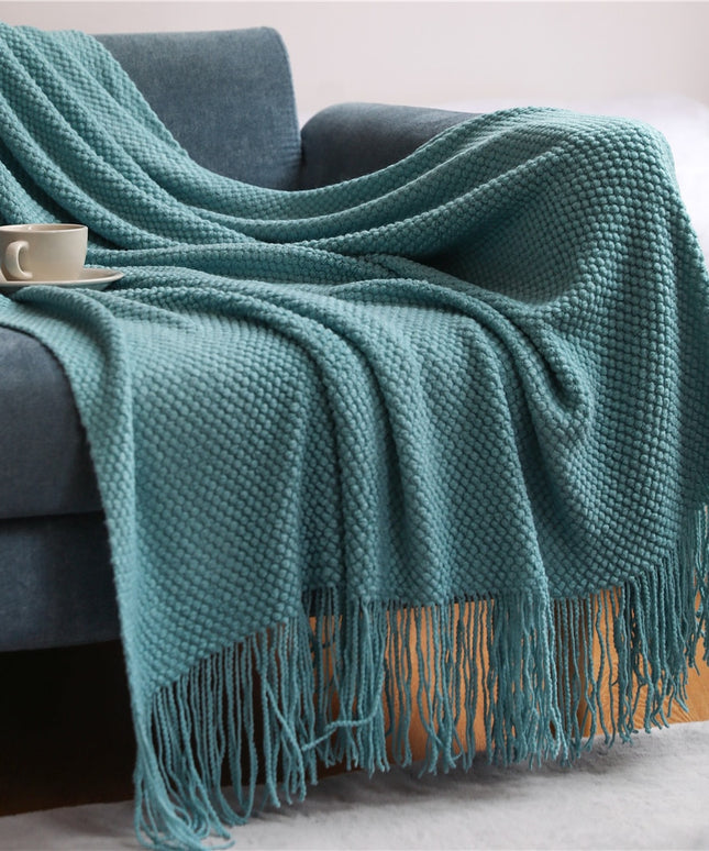 Dzianinowy koc z plecioną fakturą