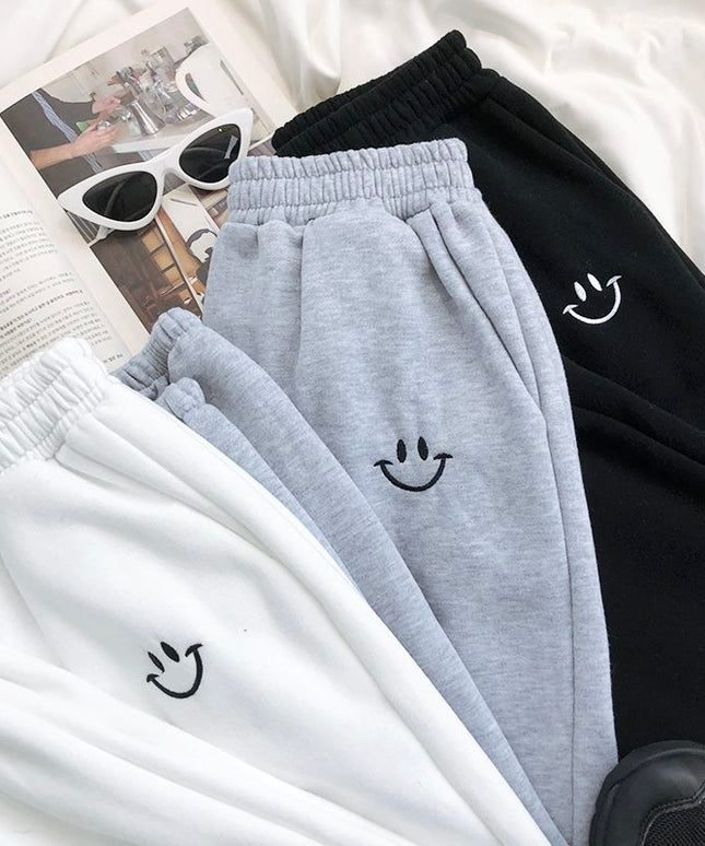 Damskie spodnie dresowe z naszywką