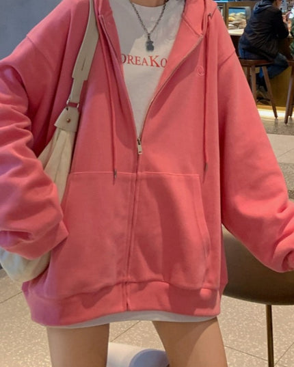 Damska bluza oversize rozpinana z kapturem i kieszeniami